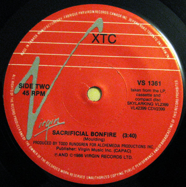 XTC : Earn Enough For Us / Sacrificial Bonfire (7", Single)